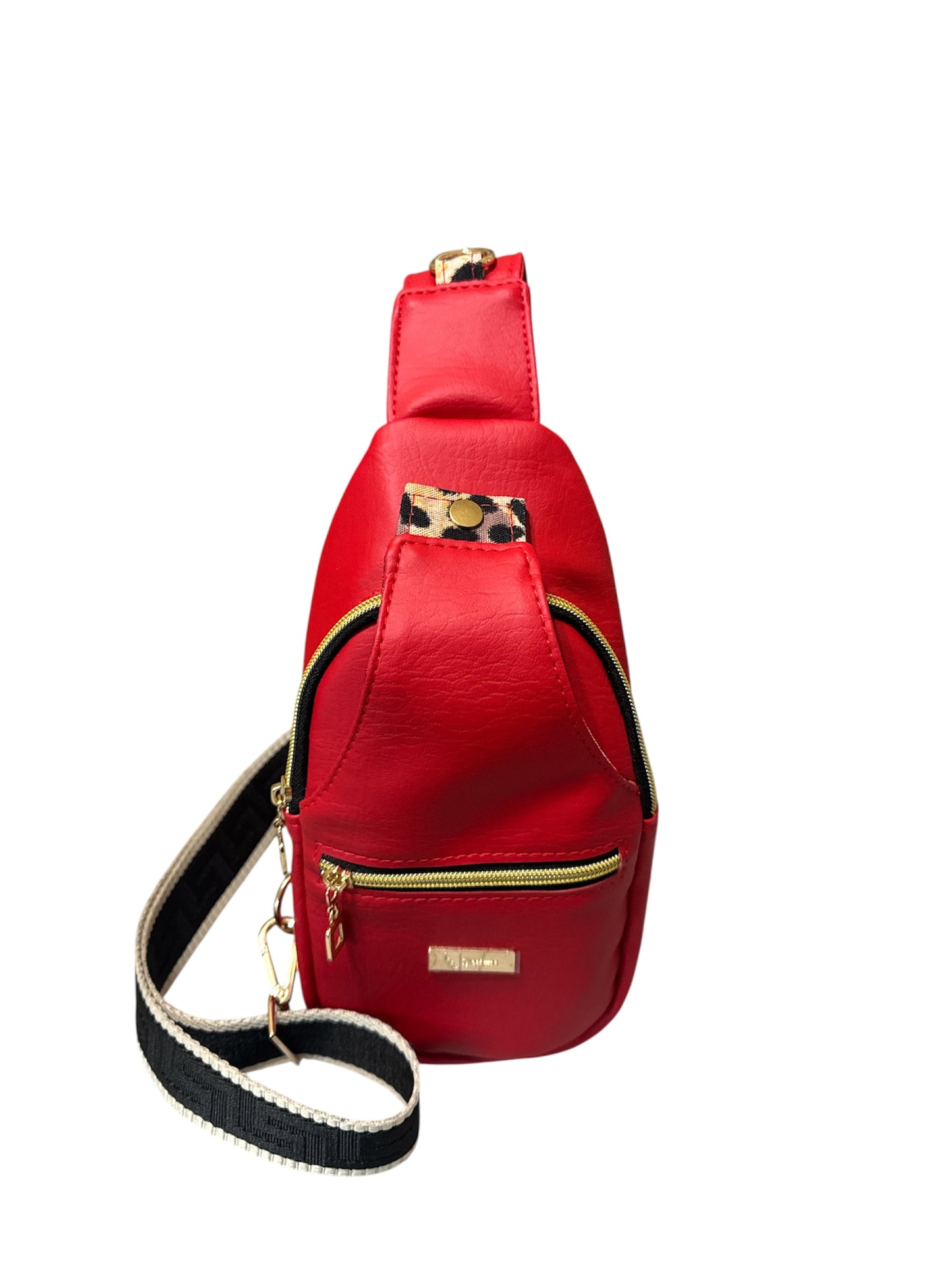 Smaller version of retro sling in bed vinyl and leopard print water resistant canvas interior.  Front and back zip pockets room front slip pocket with snap and nice main zippered compartment.  D Ring to hang and beautiful greek key design 1.5" adjustable strap.